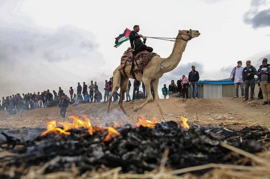 פלסטינים מפגינים בגבול עזה, 2018. | AFP