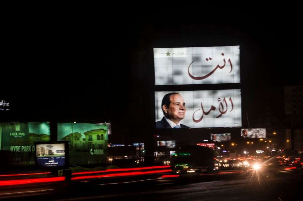 שלטי תעמולה במצרים לקראת הבחירות. | AFP שלטי תעמולה במצרים לקראת הבחירות. | AFP