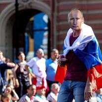 אוהד מחופש לפוטין. | EPA