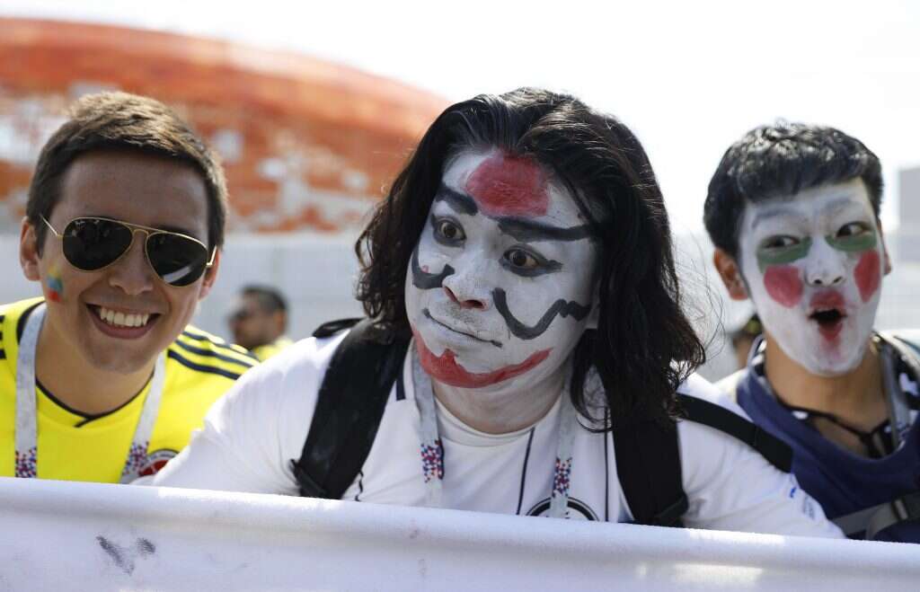 אוהדי נבחרת יפן ואוהד נבחרת קולומביה. | EPA
