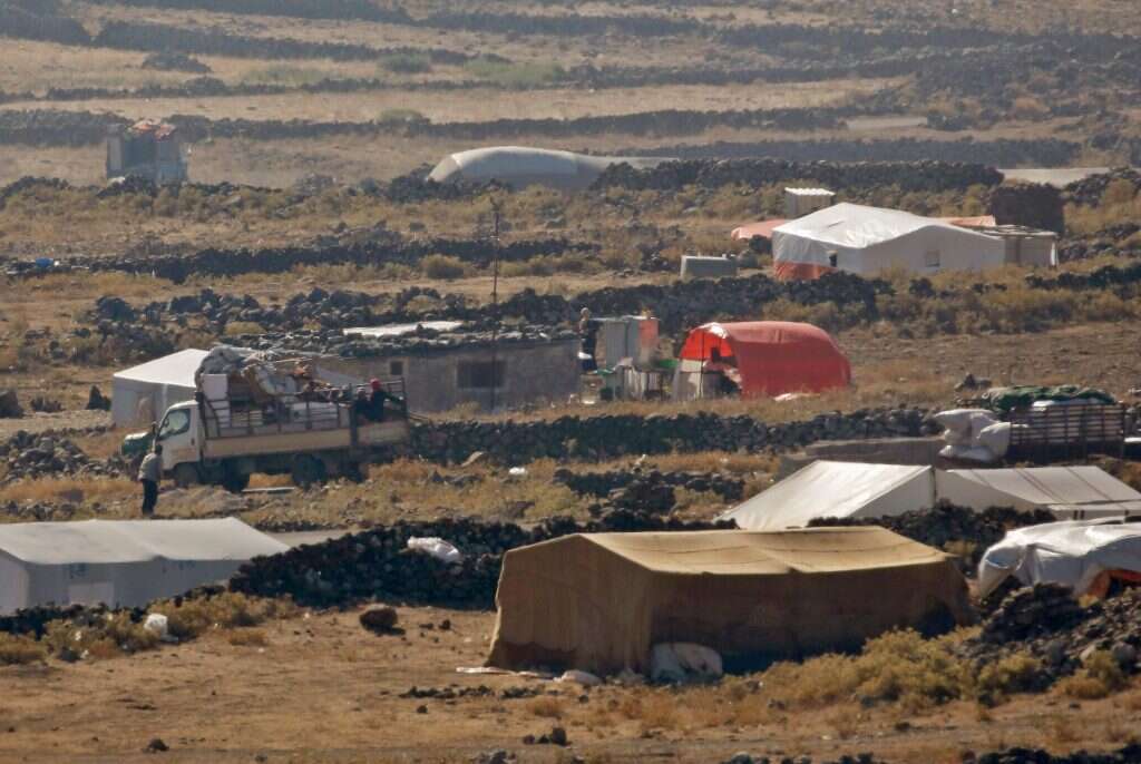 מחנה הפליטים הארעי שהוקם באזור הגבול בין ישראל לסוריה. | AFP מחנה הפליטים הארעי שהוקם באזור הגבול בין ישראל לסוריה. | AFP