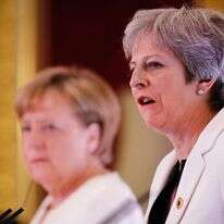 תרזה מיי ואנגלה מרקל. | AFP תרזה מיי ואנגלה מרקל. | AFP