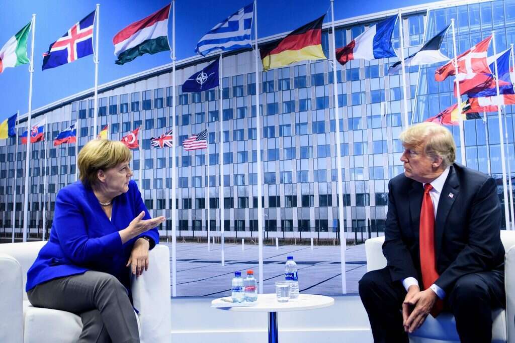 דונלד טראמפ ואנגלה מרקל. | AFP דונלד טראמפ ואנגלה מרקל. | AFP