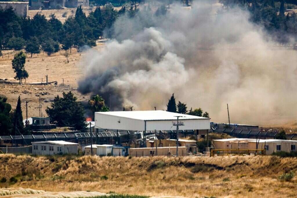 המחסן ששרפו המורדים בקוניטרה. | AFP
