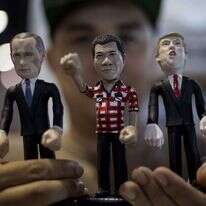 בובות של דוטרטה, פוטין וטראמפ. | AFP