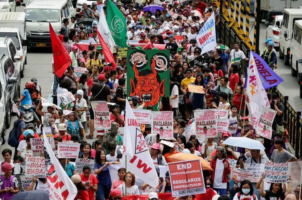 הפגנה נגד דוטרטה בעיר קזון שבפיליפינים. | EPA