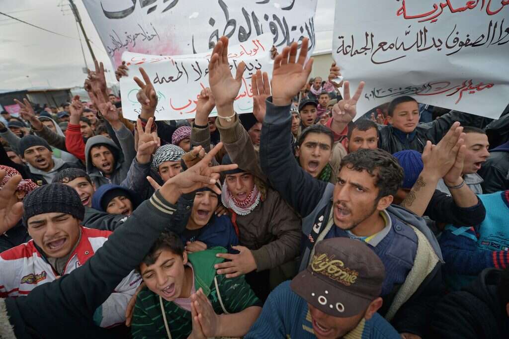 פליטים סורים מפגינים בירדן. | גטי אימג'ס פליטים סורים מפגינים בירדן. | גטי אימג'ס