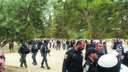 שוטר חובש כיפה בהר הבית. | אילוסטרציה: אליסף אופן