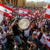 מפגינים בביירות נגד הכוונה למסות שימוש בווטסאפ, אוקטובר 2019. | EPA