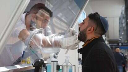 בדיקת קורונה מהירה בנתב"ג בתחילת דצמבר. | AFP