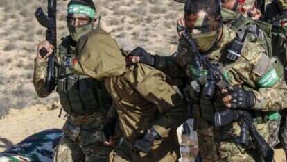 מחבלי חמאס וגא"פ מתרגלים חטיפת חייל | AFP מחבלי חמאס וגא"פ מתרגלים חטיפת חייל | AFP