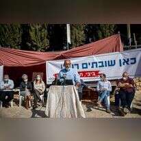 יגאל דילמוני, מנכ"ל מועצת יש"ע. במאהל המחאה. | יונתן זינדל, פלאש 90