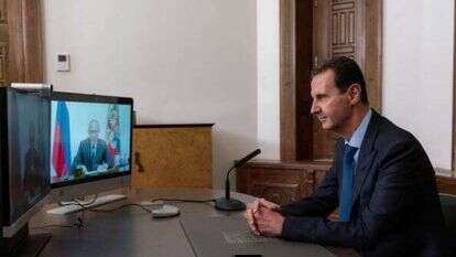 בשאר אסד במהלך פגישת וידיאו עם עמיתו הרוסי ולדימיר פוטין, בדמשק, סוריה. | EPA
