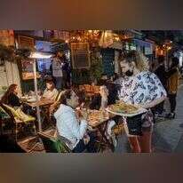 היה צריך להבדיל בין הענפים שחזרו לפעילות מלאה לענפים שחזרתם מורכבת. מסעדה בתל אביב. | AFP