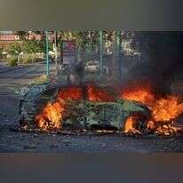 ניידת משטרה שהוצתה בלוד במהלך הפרעות במאי, 2021. | AFP