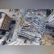 מגדל בעזה שקרס בעקבות ההפצצות במבצע שומר החומות. | AFP