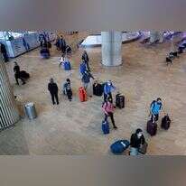 נוסעים נכנסים בנתב"ג. אילוסטרציה. | AFP