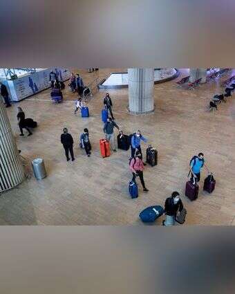 נוסעים נכנסים בנתב"ג. אילוסטרציה. | AFP