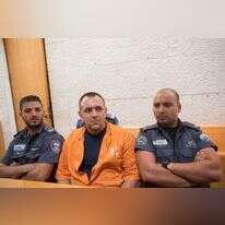 רומן זדורוב במשפטו, בשנת 2014. | יונתן זינדל, פלאש 90