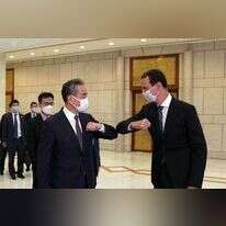 אסד עם שר החוץ הסיני בדמשק, לפני כשבוע. | AFP