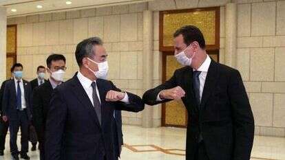 אסד עם שר החוץ הסיני בדמשק, לפני כשבוע. | AFP אסד עם שר החוץ הסיני בדמשק, לפני כשבוע. | AFP