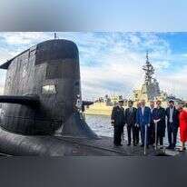 מקרון (שני משמאל) וראש ממשלת אוסטרליה דאז טרנבול (במרכז) בסידני, 2018. | AFP