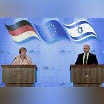 נפתלי בנט ואנגלה מרקל. | EPA