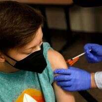 חיסון של פייזר מוענק לילד אמריקני במישיגן, השבוע. | AFP