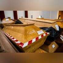 ארונות מתים של חולי קורונה בגרמניה. | AFP