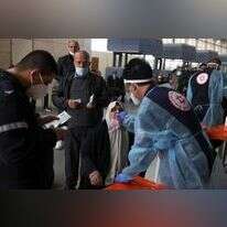 בדיקות קורונה בנתב"ג. | AFP