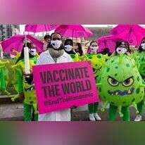 מפגינים בבריטניה דורשים חלוקת חיסונים נגד קורונה למדינות מתפתחות. | EPA