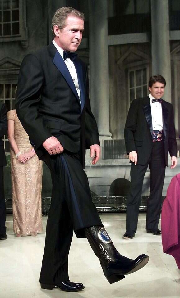 בוש ומגפי הבוקרים. | AFP