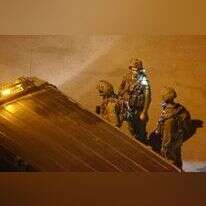 חיילי צה"ל בזירת הפיגוע בקריית ארבע. | AFP