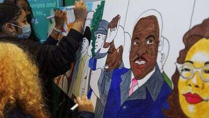 סטודנטים אמריקאיים עם תערוכת אומנות לזכר מרטין לות'ר קינג. | EPA