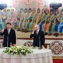 שי עם פוטין במפגש בקרמלין השבוע. | איי.אף.פי