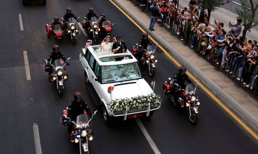 הנסיך הירדני וכלתו בחתונתם. | Khalil MAZRAAWI AFP הנסיך הירדני וכלתו בחתונתם. | Khalil MAZRAAWI AFP