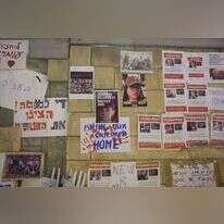 תמונות חטופים על קירות הקריה בתל אביב. | EPA