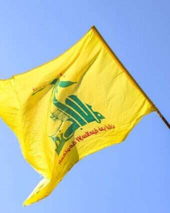 תומך חיזבאללה מפגין בלבנון. | AFP