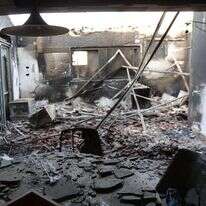 חדר סלון בקיבוץ בארי,לאחר טבח ה-7.10. | EPA