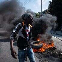 מפגינים נגד הממשלה בהאיטי. | EPA