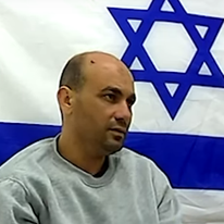 המחבל בכר קניטה בחקירתו. | מסך מיוטיוב, באדיבות דו"צ