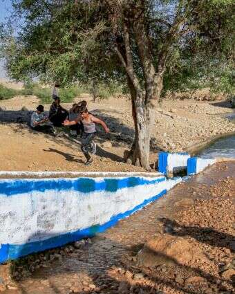 ישראלים ופלסטינים במעיין עוג'ה. | נאסר אישתאיה - פלאש 90