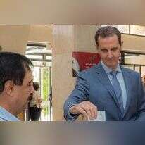 בשאר אל-אסד מצביע בבחירות בסוריה, יולי 24'. | AFP