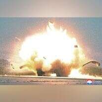 פיצוץ במהלך ניסוי המל"טים המתאבדים בצפון קוריאה. | EPA פיצוץ במהלך ניסוי המל"טים המתאבדים בצפון קוריאה. | EPA