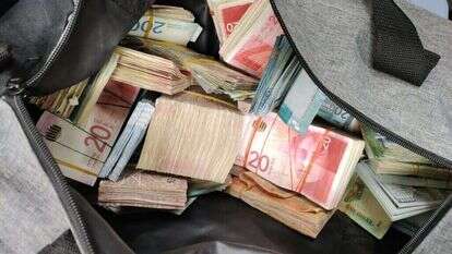 כספים שנתפסו במהלך הפעילות. | משטרת ישראל