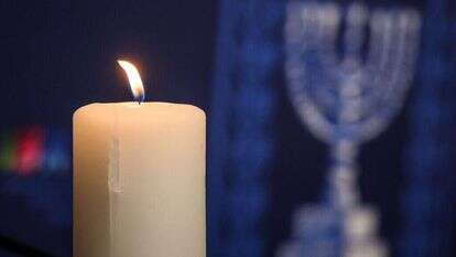 נר זיכרון בטקס לזכר ה7.10 במשרדי האו"ם בז'נבה. | AFP