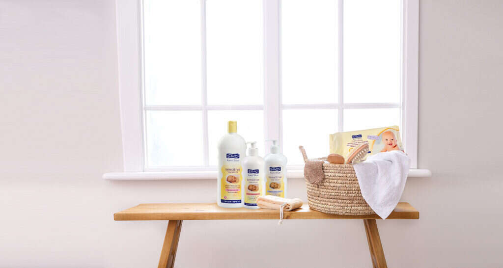 Body care accessories on bench in bathroom