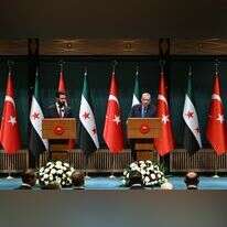 ארדואן ואחמד א-שרע. | AFP