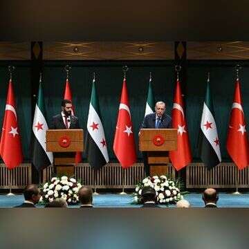 ארדואן ואחמד א-שרע. | AFP