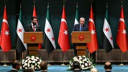 ארדואן ואחמד א-שרע. | AFP